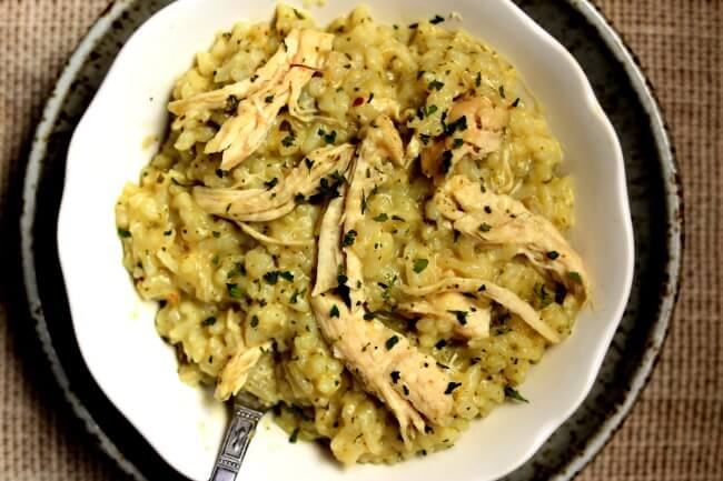 Slow Cooker Pesto Chicken Risotto--creamy no fuss and no stir pesto risotto with tender bites of chicken made in your crockpot. 