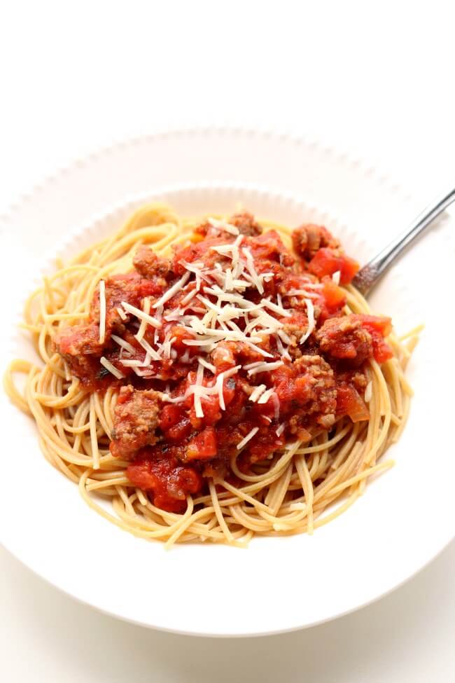 Instant Pot Homemade Spaghetti Sauce--a meaty pressure cooker spaghetti sauce that only takes 10 minutes under pressure to taste like a sauce that has simmered all day. I like to serve this sauce over any pasta or over spaghetti squash.