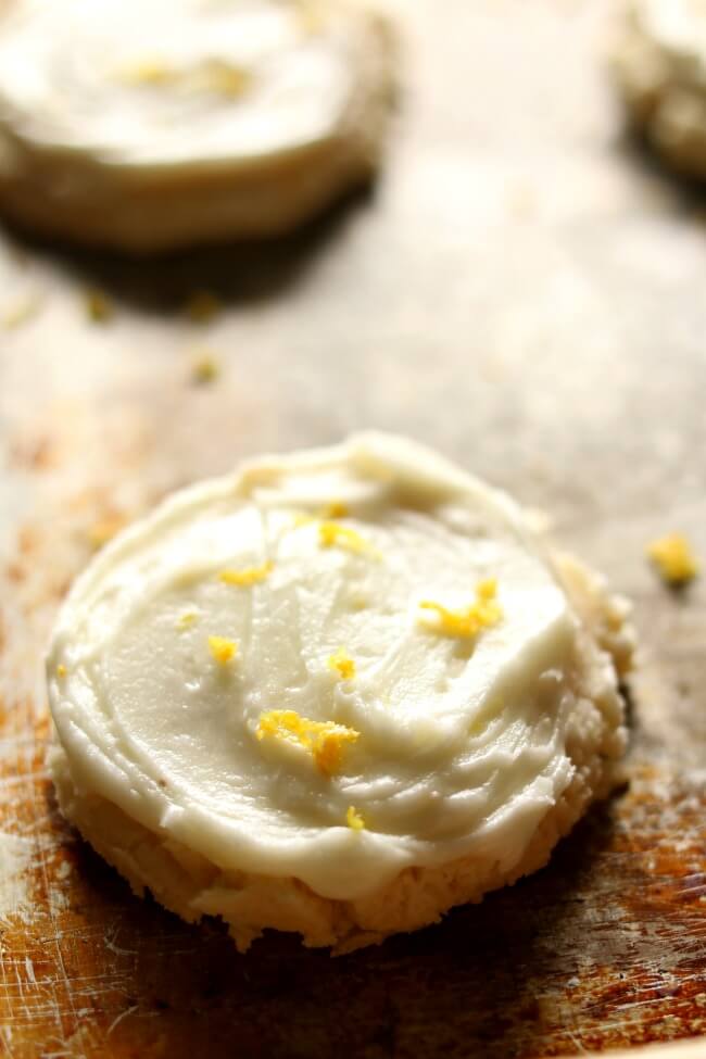 Soft Lemon Sugar Cookies--you'll never want plain old sugar cookies again after you try these! The lemon flavor is obvious but does not overtake the cookie. The cookie is soft and almost like a cross between sugar cookie and shortbread. The frosting is a must and ties everything together in a beautiful and delicious bow. I dare you to just eat ONE cookie. It's impossible.