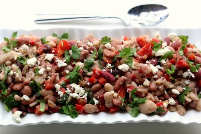 15 Bean Salad --a variety of dried beans are cooked in your electric pressure cooker or slow cooker and then stirred together with a red wine vinaigrette dressing, red bell pepper, feta cheese and cilantro. This salad serves a crowd and is perfect for a potluck or picnic. 