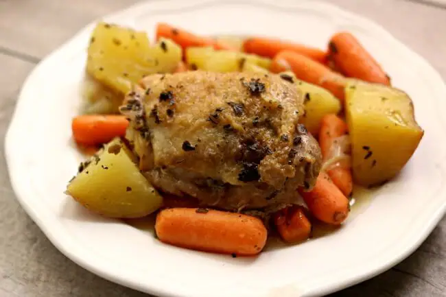 Instant Pot Lemon Herbed Chicken and Red Potatoes--a one pot meal that has lots of flavor. Chicken is browned and then quickly pressure cooked with red potatoes, baby carrots, seasonings and lemon juice.Â 
