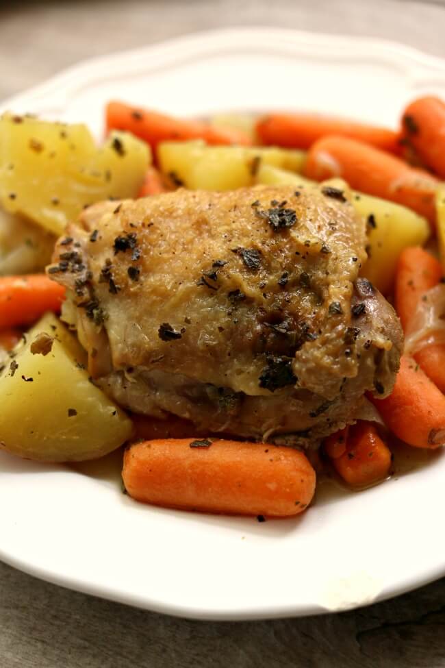 Slow Cooker Lemon Herbed Chicken and Red Potatoes--a one pot meal that has lots of flavor. Chicken is slow cooked with red potatoes, baby carrots, seasonings and lemon juice. A simple but delightful meal!