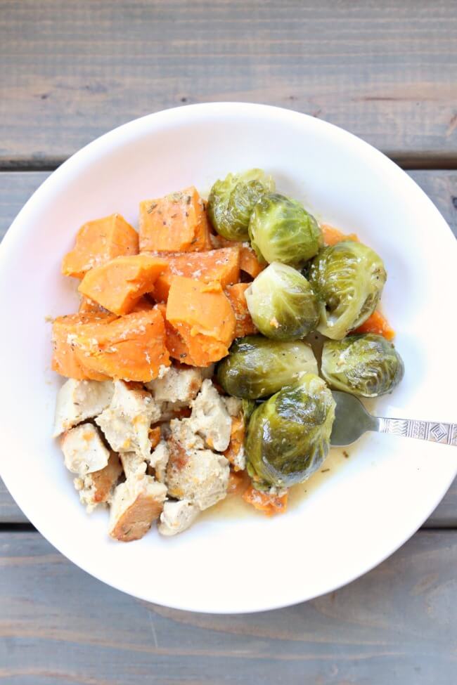 Slow Cooker or Instant Pot Maple Dijon Chicken and Sweet Potatoes–chicken, sweet potatoes and brussels sprouts drizzled with a sauce made with maple syrup, dijon mustard, rosemary and olive oil. A simple one pot recipe with a delicious flavor!