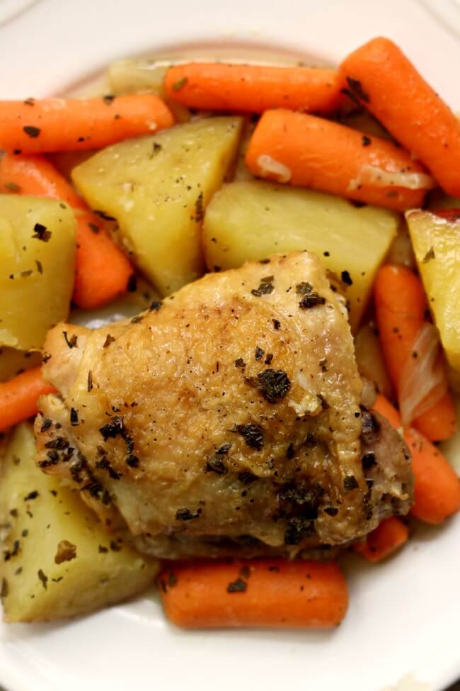Slow Cooker Lemon Herbed Chicken and Red Potatoes--a one pot meal that has lots of flavor. Chicken is slow cooked with red potatoes, baby carrots, seasonings and lemon juice. A simple but delightful meal!