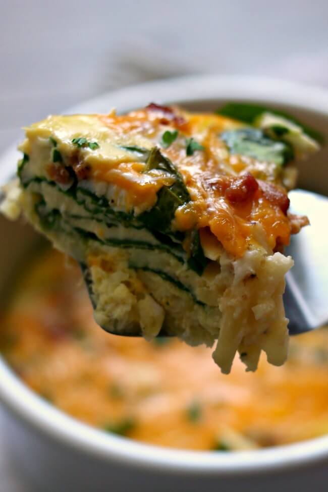 Instant Pot Bacon Cheddar Egg Casserole--hashbrowns, eggs, bacon, cheddar and spinach are all combined to make a scrumptious breakfast casserole that is perfect for a weekend breakfast or even breakfast for dinner. 