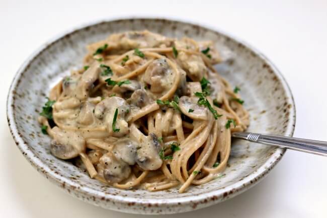 Instant Pot Savory Mushroom Chicken--a creamy savory sauce envelopes mushrooms, tender bites of chicken and linguine noodles. This is a quick and easy meal for any night of the week.