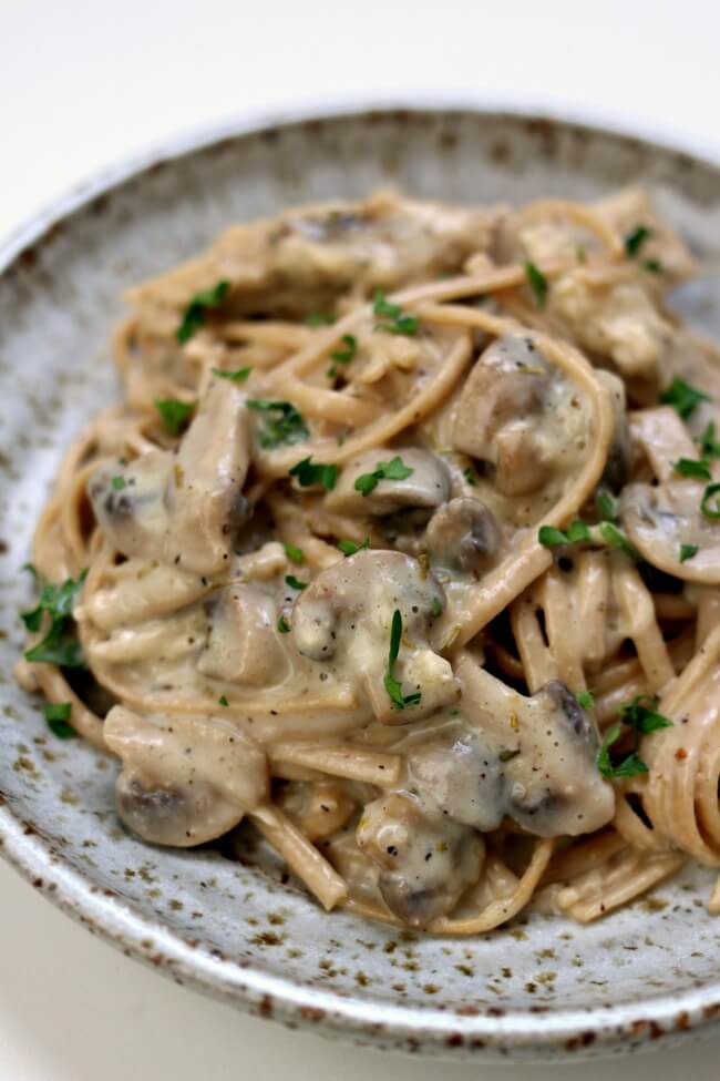 Instant Pot Savory Mushroom Chicken--a creamy savory sauce envelopes mushrooms, tender bites of chicken and linguine noodles. This is a quick and easy meal for any night of the week.