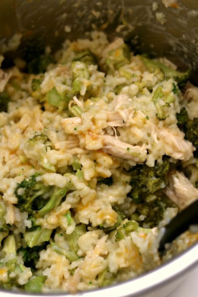 Instant Pot Cheesy Broccoli Rice--creamy risotto-like rice with cheddar, broccoli and (optional) pieces of chicken breast. A one pot family-friendly meal perfect for a busy weeknight. 