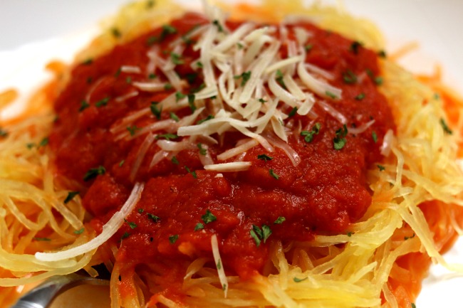 Easy Slow Cooker Spaghetti Sauce and Spaghetti Squash--this spaghetti sauce is so delicious you'll be licking your plate. The funny part is that it only takes a handful of easy ingredients. Bonus--if you want to cook a spaghetti squash at the same time as the sauce you can!Â 