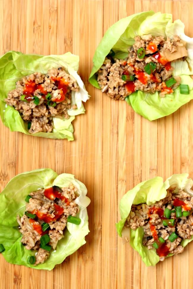 Instant Pot Chicken Lettuce Wraps--an incredibly easy and delicious recipe for lettuce wraps. Hoisin sauce gives these ground chicken lettuce wraps lots of flavor and the rice and water chestnuts adds texture. Get a whole head of lettuce ready because you're not going to want to stop eating these chicken lettuce wraps! 