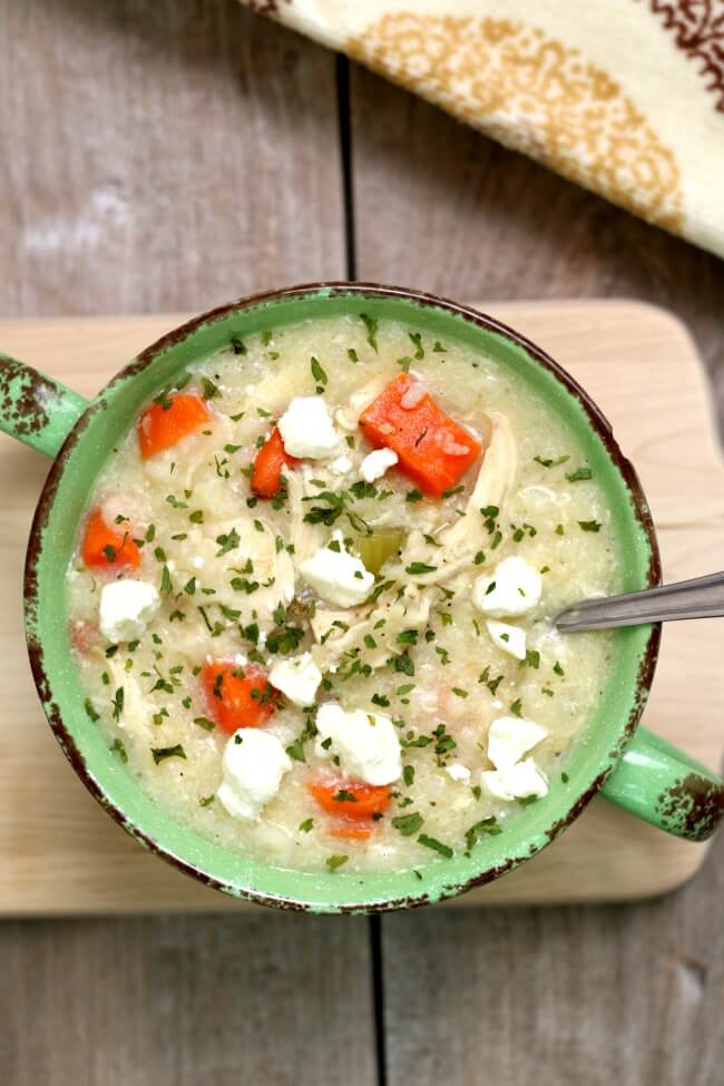 Instant Pot Greek Chicken Lemon Rice Soup--this is a heartier version of creamy Greek avgolemono soup. It has tender bites of chicken, rice, carrots and of course fresh lemon juice. This soup has unbelievable flavor!  And it's made quickly in your electric pressure cooker. 