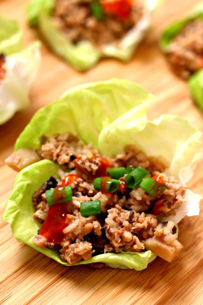 Instant Pot Chicken Lettuce Wraps--an incredibly easy and delicious recipe for lettuce wraps. Hoisin sauce gives these ground chicken lettuce wraps lots of flavor and the rice and water chestnuts adds texture. Get a whole head of lettuce ready because you're not going to want to stop eating these chicken lettuce wraps!Â 