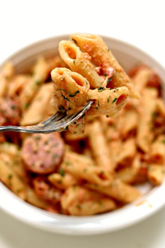 Make this Instant Pot Penne in Cajun Mustard Cream Sauce for a quick and easy weeknight meal. With options to make it with andouille sausage or meatless you can make everyone happy. 
