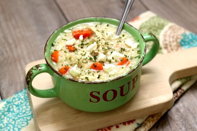 Slow Cooker Greek Chicken Lemon Rice Soup--this is a thick and hearty version of creamy Greek avgolemono soup. It has tender bites of chicken, rice, carrots and of course fresh lemon juice. This soup has unbelievable flavor! 