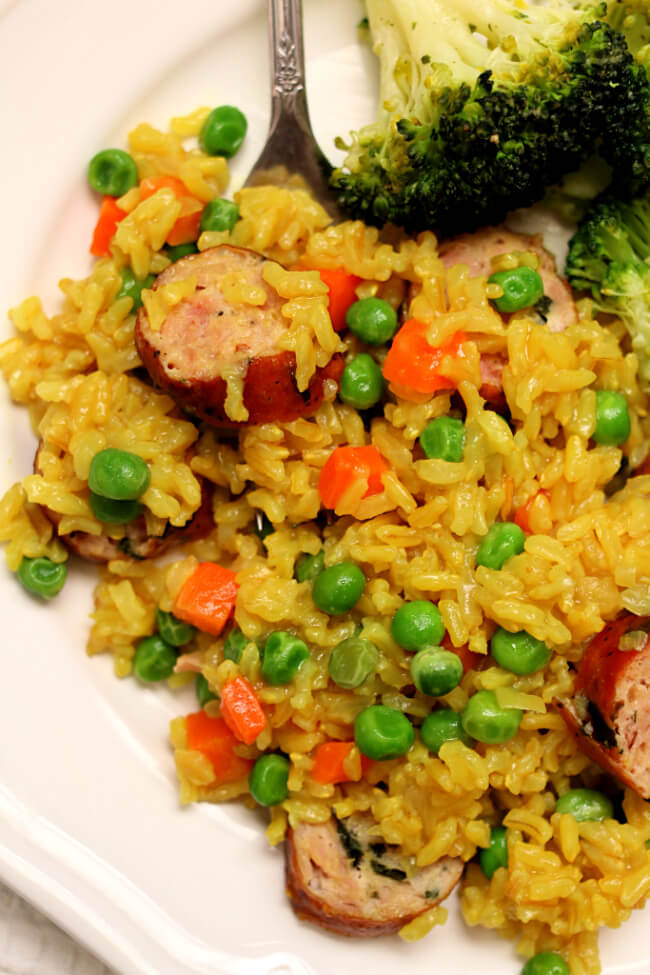 Slow Cooker Brown Rice Pilaf with Chicken Sausage--an easy and healthy meal of seasoned brown rice with carrots, peas and chicken sausage. 