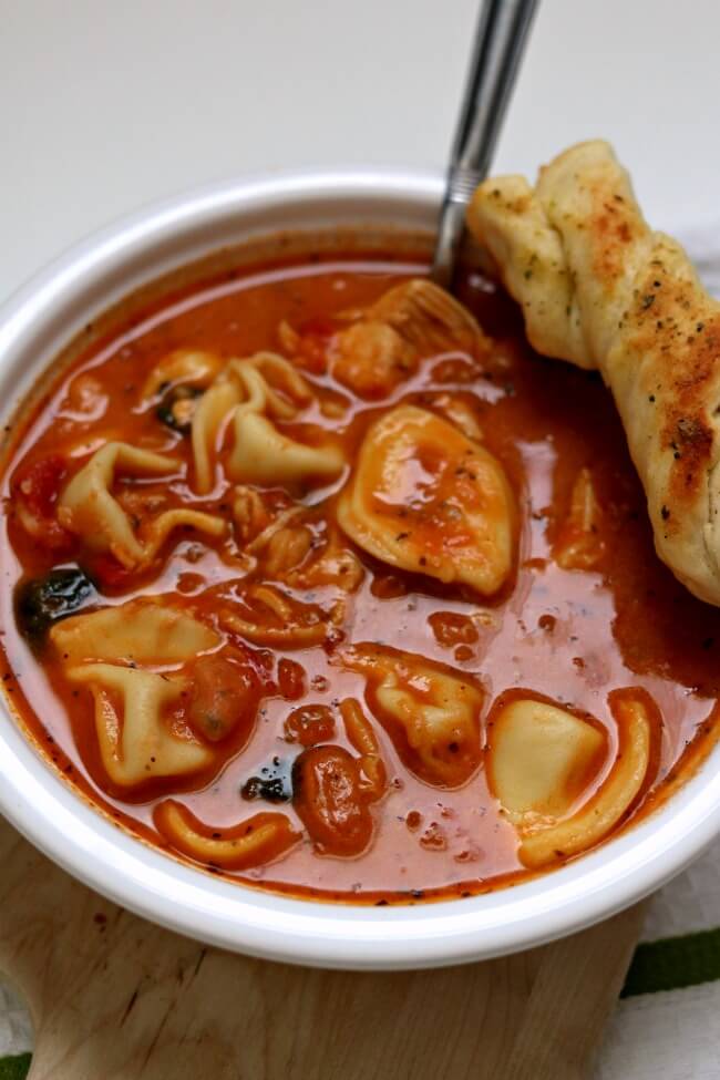 Slow Cooker Tuscan Tortellini Soup is a creamy tomato based soup with white beans, tortellini, spinach and tender bites of chicken. Take one bite of this soup and you'll quickly agree that this soup rocks the house. 