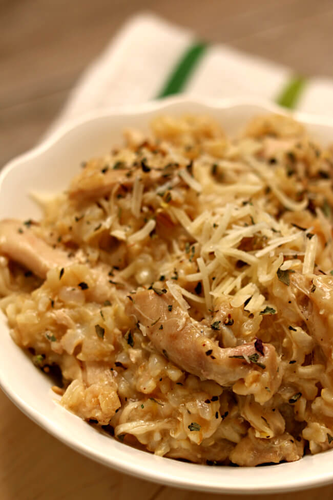 Instant Pot Lemon Chicken and Rice--brown rice is cooked with garlic, onion, lemon juice and juicy chicken thighs for a easy one pot dinner that's low on effort and high on taste. 