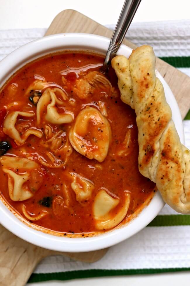 Slow Cooker Tuscan Tortellini Soup is a creamy tomato based soup with white beans, tortellini, spinach and tender bites of chicken. Take one bite of this soup and you'll quickly agree that this soup rocks the house. 