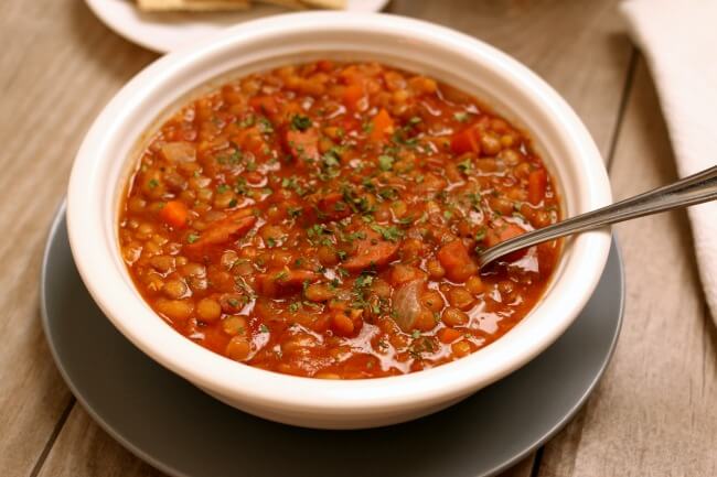 Instant Pot Lentil Stew--a comforting bowl of stew that can be make vegan or can be made with smoked sausage. Lentils cook so quickly in the electric pressure cooker! The leftovers make a great lunch the next day too.