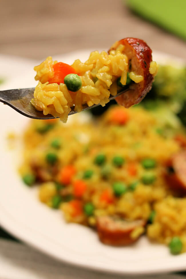 Instant Pot Brown Rice Pilaf with Chicken Sausage--a quick, easy and healthy meal of seasoned brown rice with carrots, peas and chicken sausage. 