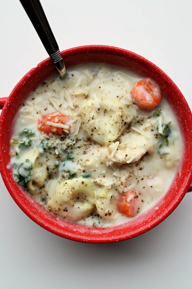 Instant Pot Chicken Alfredo Tortellini Soup--A creamy tortellini soup with chicken, vegetables and parmesan cheese. If you love chicken alfredo you'll love this soup!
