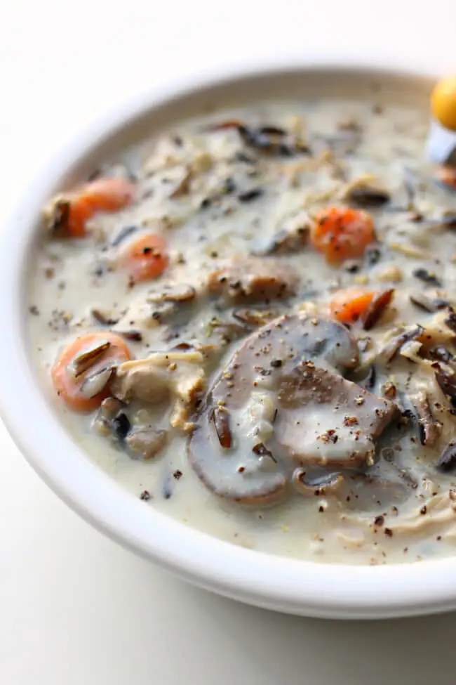 Instant Pot Chicken Mushroom Wild Rice Soup--A creamy soup that is full of lots of goodness–wild rice, chicken, mushrooms, carrots and celery.