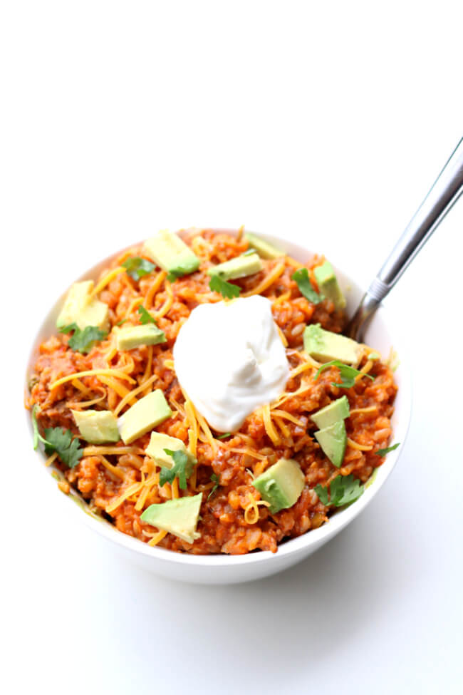 Instant Pot Salsa Rice--With just 5 ingredients and a few minutes you can make a delicious dinner that your family will love. A saucy, cheesy rice with browned sausage.  