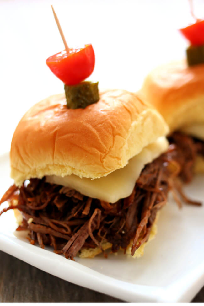Instant Pot BBQ Brisket Sliders–tender and moist shredded or sliced beef brisket piled on a soft roll and topped with a slice of pepper jack cheese. A perfect recipe to make for game day. 