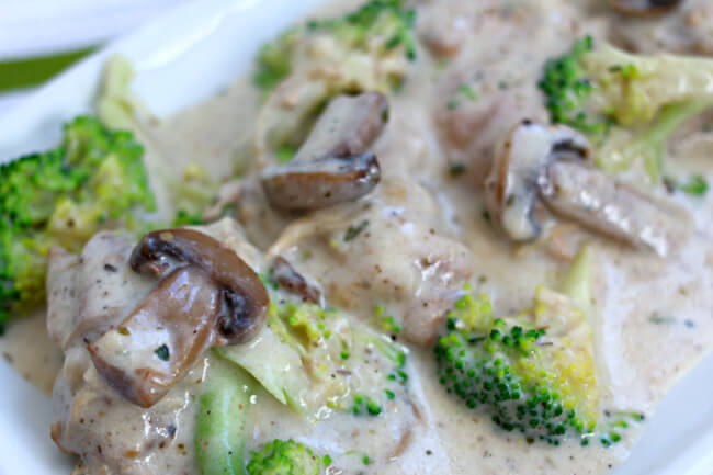 Instant Pot Garlic Mushroom Chicken—a creamy sauce served with a spoon over mushrooms, tender chicken bites (and optional broccoli). A delicious dump and go recipe that you can make with frozen chicken. ï»¿
