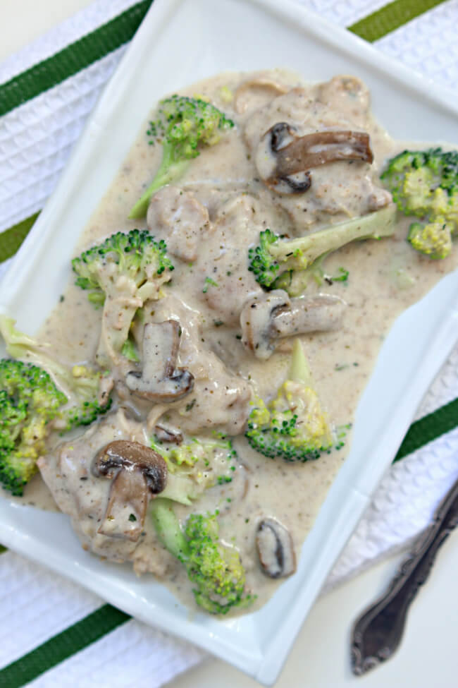 Instant Pot Garlic Mushroom Chicken--a creamy sauce is spooned over mushrooms, tender bites of chicken (and optional broccoli). A delicious dump and go recipe that you can make with frozen chicken. ﻿