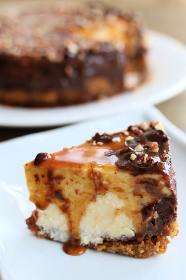 Pressure Cooker Turtle Cheesecake is a decadent cheesecake made with a graham cracker crust and plenty of pecans, caramel and chocolate. It’s baked in your electric pressure cooker to ensure consistent results every time.