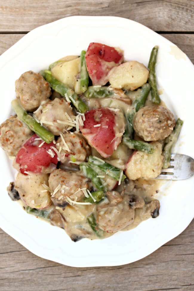 Instant Pot Meatballs and Red Potatoes with Creamy Parmesan Sauce--Red potatoes, green beans, meatballs and mushrooms are all covered in a creamy parmesan sauce. An easy one pot meal. Frozen meatballs are used for easy prep purposes.  