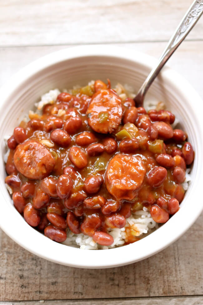 Instant Pot Red Beans and Rice--dried small red beans are pressure cooked quickly and simmered with cajun sausage, onion, green pepper and cajun seasonings to make a saucy stew to serve over rice. And the rice can be cooked at the same time and in the same pot as the red beans!