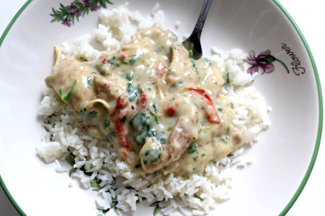 Slow Cooker Creamy Tuscan Chicken--creamy chicken and sauce with sun-dried tomatoes, spinach, Parmesan cheese and garlic. ﻿