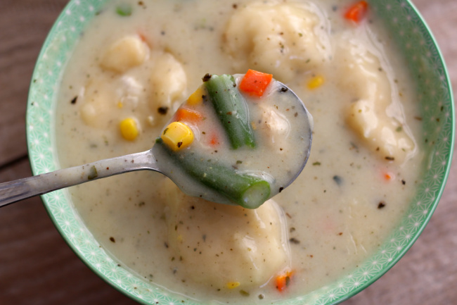 Slow Cooker Chicken and Dumplings--a creamy chicken soup with dumplings and mixed vegetables. Make this classic dish easily in your slow cooker! 