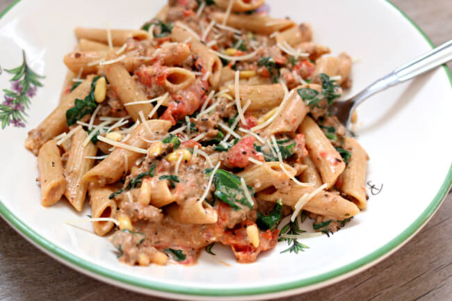 Instant Pot Creamy Beef and Penne--ground beef, garlic, penne pasta, 
fire roasted tomatoes, cream cheese, spinach and pine nuts cooked quickly and in one pot, your Instant Pot.  An amazing pasta dish that your whole family will love!﻿