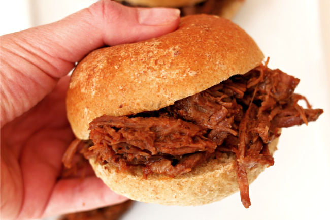 Instant Pot BBQ Beef Sandwiches--tender shredded beef with an easy homemade barbecue sauce served on a toasted bun. An easy and delicious dinner!﻿