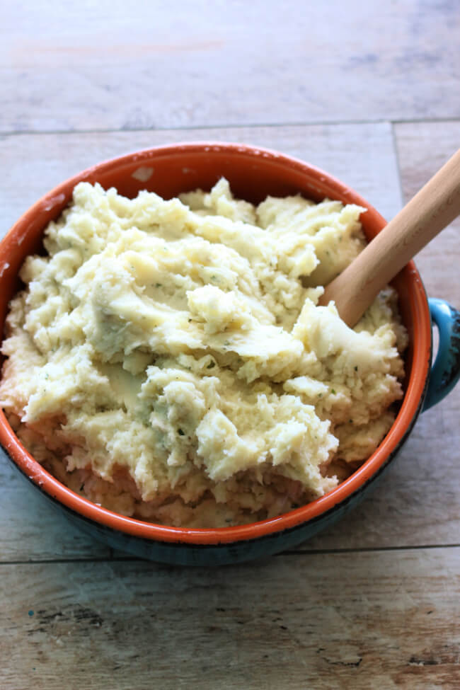 Instant Pot Ranch Mashed Potatoes--creamy, buttery mashed potatoes with flavorful ranch dressing mix that gives the potatoes a tangy twist. And they are made so fast in your electric pressure cooker!
