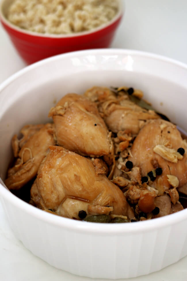 Slow Cooker Chicken Adobo--an easy 6-ingredient recipe for the tastiest chicken ever! A Filipino recipe of tender chicken thighs braised in vinegar and soy sauce with lots of garlic. 