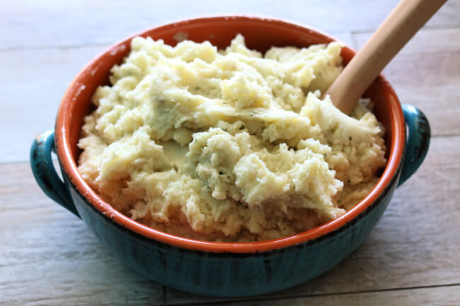 Instant Pot Ranch Mashed Potatoes--creamy, buttery mashed potatoes with flavorful ranch dressing mix that gives the potatoes a tangy twist. And they are made so fast in your electric pressure cooker!