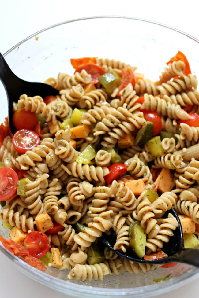 Instant Pot Dill Pickle Pasta Salad--say goodbye to boring pasta salads and hello to this pasta salad that is infused with pickle flavor! Make the pasta quickly and easily with your Instant Pot.