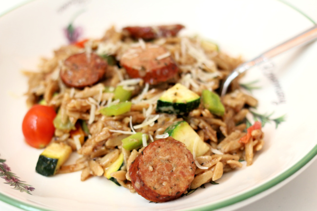 Instant Pot Garlic Chicken Sausage Orzo--orzo pasta with a tangy dijon-balsamic sauce, chicken smoked sausage, zucchini, tomatoes, peppers and parmesan cheese. Loads of flavor and an all in one pot dinner!