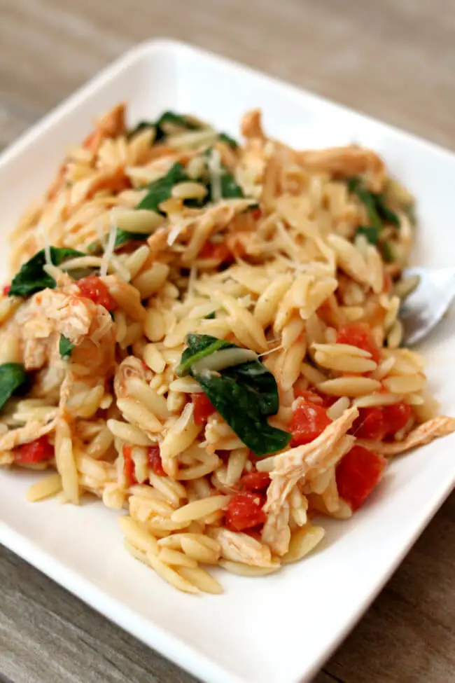 Instant Pot Chicken Spinach Parmesan Orzo--a one pot meal with chicken, pasta, tomatoes, spinach and parmesan cheese. 