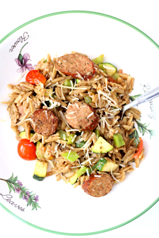 Instant Pot Garlic Chicken Sausage Orzo--orzo pasta with a tangy dijon-balsamic sauce, chicken smoked sausage, zucchini, tomatoes, peppers and parmesan cheese. Loads of flavor and an all in one pot dinner!
