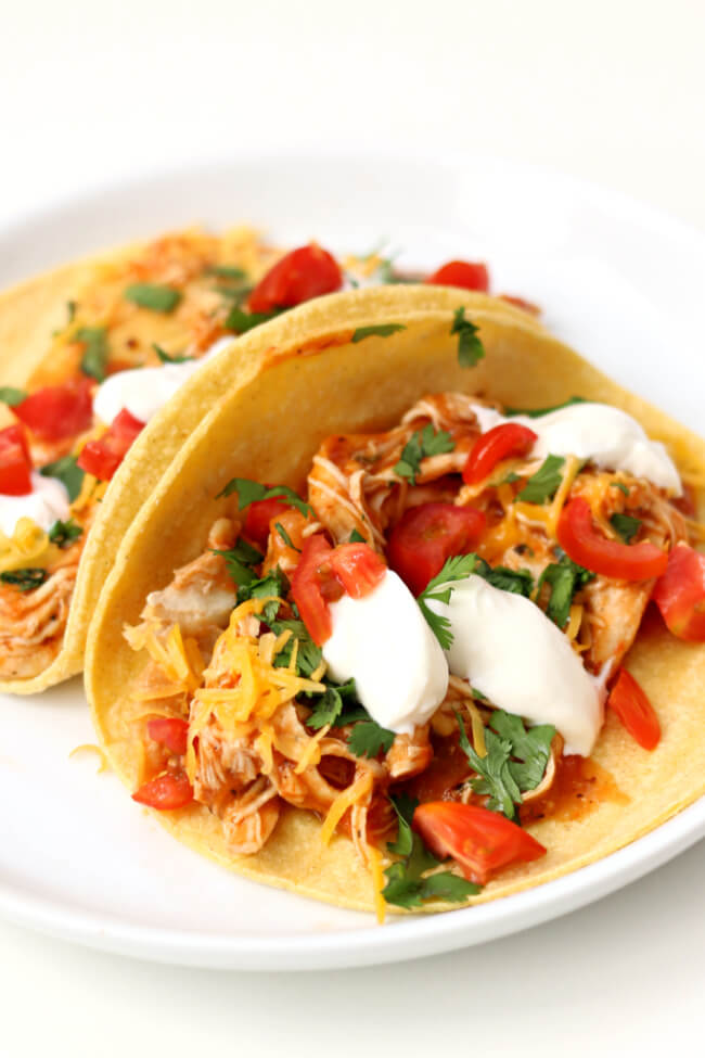 Slow Cooker Chicken Tinga Tacos--easy to make smoky chicken tacos with all the fixings. A fresh weeknight meal that comes together quickly. 