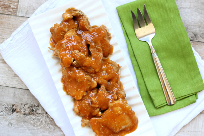 Slow Cooker Firecracker Chicken--sweet and spicy tender pieces of saucy chicken made in your slow cooker. 