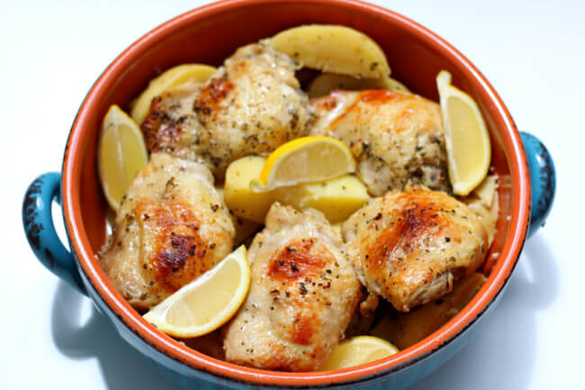 Slow Cooker Greek Chicken and Potatoes--with loads of flavor this chicken and potatoes dish will quickly become a family favorite at your house. It has the perfect amount of seasoning and lemon flavor. 
