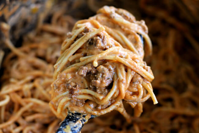 Instant Pot Million Dollar Spaghetti--spaghetti but a whole lot better. A ground beef sauce is served with spaghetti noodles and then cream cheese is stirred in for an ultimate creamy dinner. Kids and adults love this spaghetti!
