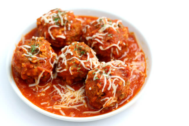 Instant Pot Porcupine Meatballs--a fun twist on a traditional meatball recipe. Uncooked rice is mixed with ground beef to make a meatball that looks like it has porcupine quills. My version is made quickly in the Instant Pot and served with an amazingly easy homemade marinara sauce.  