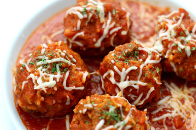 Instant Pot Porcupine Meatballs--a fun twist on a traditional meatball recipe. Uncooked rice is mixed with ground beef to make a meatball that looks like it has porcupine quills. My version is made quickly in the Instant Pot and served with an amazingly easy homemade marinara sauce.  